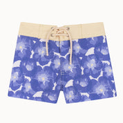 Blue floral-patterned shorts with a beige waistband on a white background