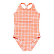 Coral checkered swimsuit with white floral details on a white background