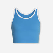 A sleeveless azure blue active top with white trim, designed for sports and everyday wear.