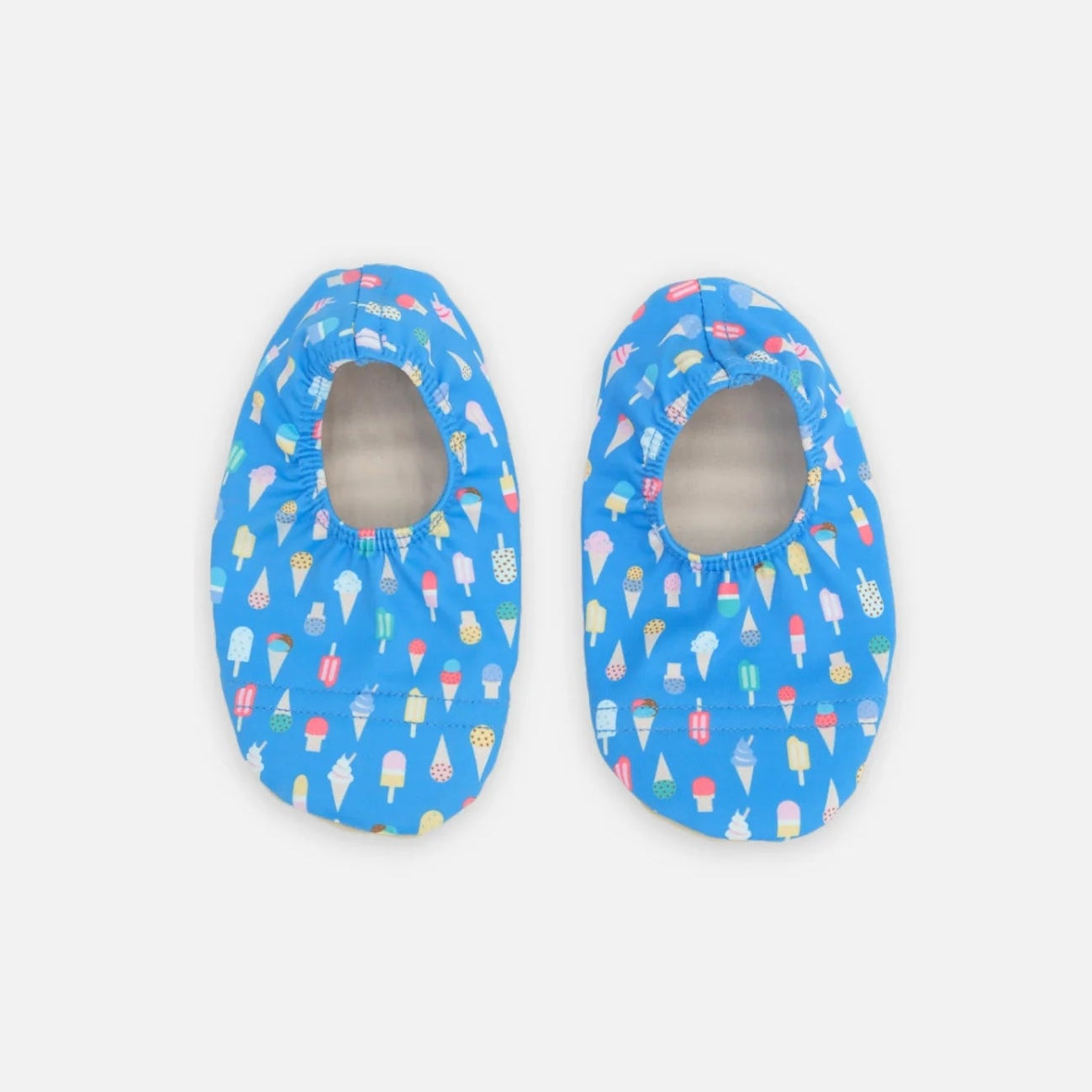 Pair of blue baby shoes with colorful patterns on a light gray background